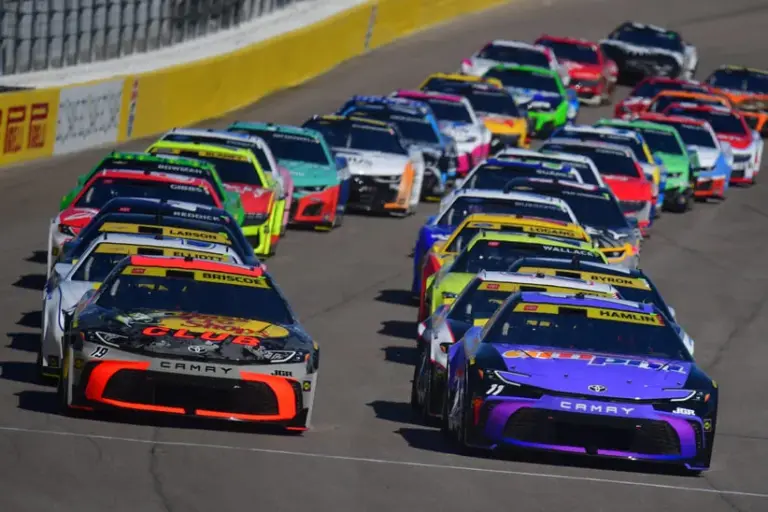 Oct 12, 2025; Las Vegas, Nevada, USA; NASCAR Cup Series driver Chase Briscoe (19) and driver Denny Hamlin (11) lead the field for the start of the South Point 400 at Las Vegas Motor Speedway.