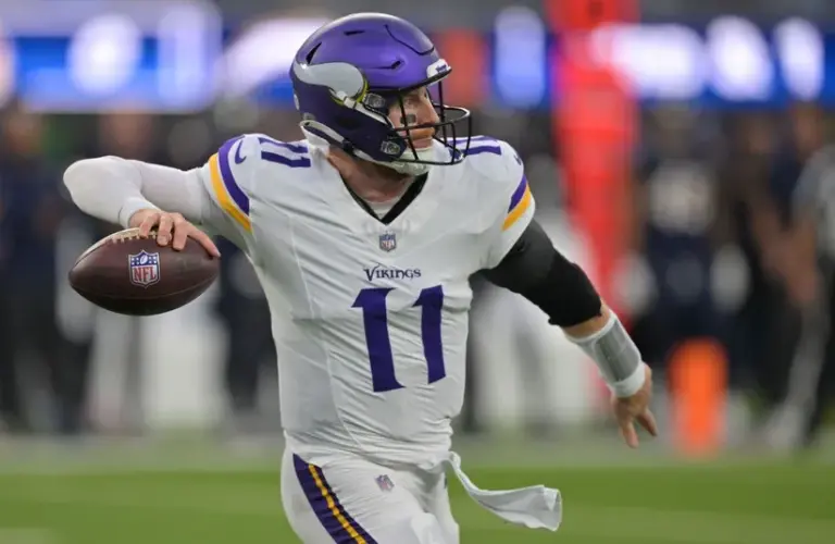 Minnesota Vikings quarterback Carson Wentz (11) drops back to pass