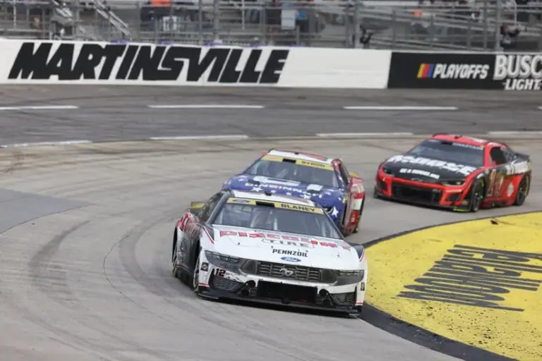 Oct 26, 2025; Martinsville, Virginia, USA; NASCAR Cup Series driver Ryan Blaney (12) leads during stage three of the Xfinity 500 at Martinsville Speedway.