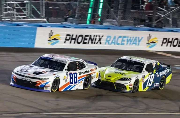 Nov 1, 2025; Avondale, Arizona, USA; NASCAR Xfinity Series driver Connor Zilisch (88) leads Aric Almirola (19) during the Xfinity Series Championship race at Phoenix Raceway.