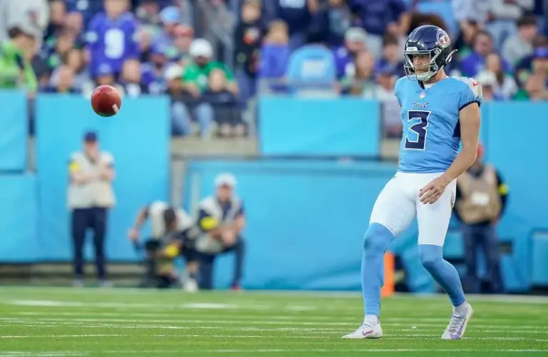 Tennessee Titans punter Johnny Hekker (3) makes an unsuccessful onside kick