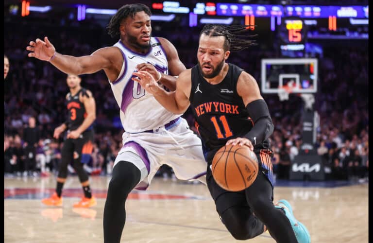 New York Knicks Jalen Brunson drives to the basket on Utah Jazz player