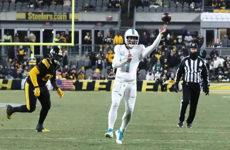 Miami Dolphins quarterback Tua Tagovailoa (1) throws a touchdown pass