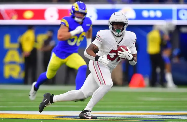 Arizona Cardinals running back Emari Demercado (31) runs after a catch against the Los Angeles Rams in the second half at SoFi Stadium.
