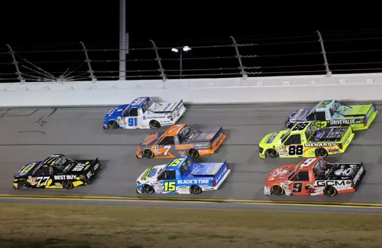 Darlington; Feb 13, 2026; Daytona Beach, Florida, USA; NASCAR Truck Series driver Carson Hocevar (77) races Christian Eckes (91), Michael McDowell (7), Tanner Gray (15), John Hunter Nemecheck (62), Ty Majeski (88) and Grant Enfinger (9) during the Craftsman Truck series Fresh From Florida 250 at Daytona International Speedway.