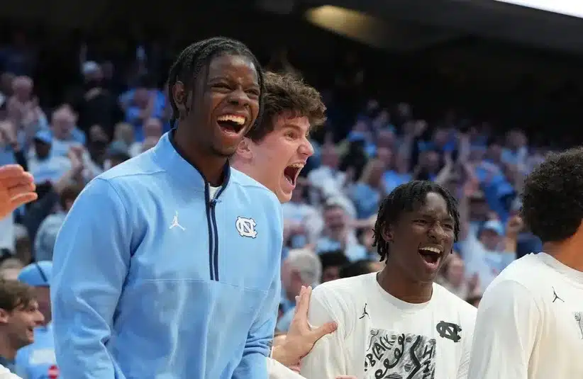 North Carolina Tar Heels forward Caleb Wilson (8) and the bench react