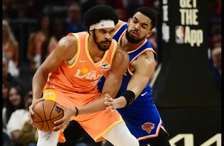 New York Knicks center Karl-Anthony Towns (32) defends Cleveland Cavaliers center Jarrett Allen (31) during the first half at Rocket Arena.