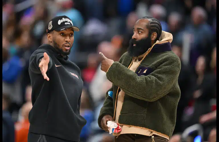 Cleveland Cavaliers guard Donovan Mitchell (left) talks with teammate James Harden during a timeout against the Detroit Pistons in the second half at Little Caesars Arena.
