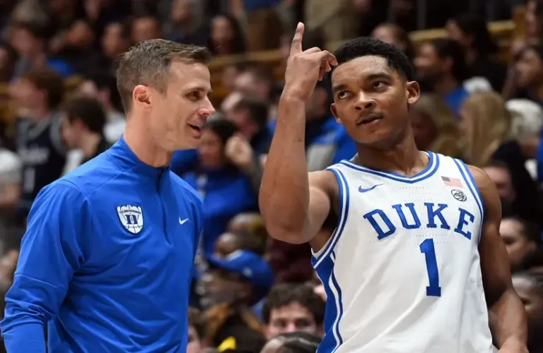 Duke Blue Devils guard Caleb Foster (1) gestures to head coach Jon Scheyer