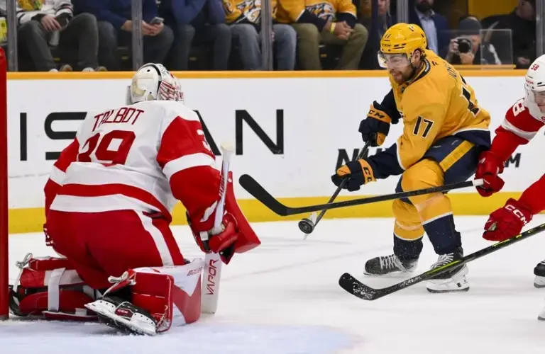 Detroit Red Wings goaltender Cam Talbot (39) blocks the shot of Nashville Predators center Tyson Jost (17)