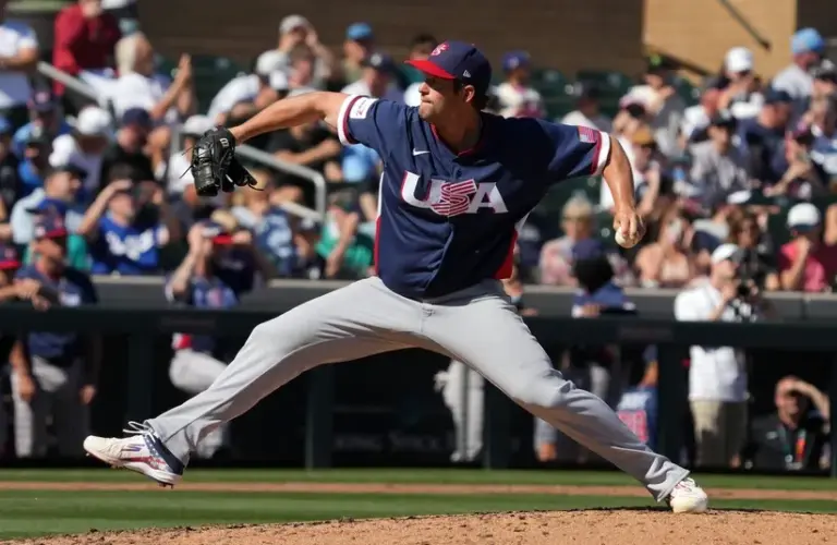 United States pitcher Clayton Kershaw (22) throws against the Colorado Rockies