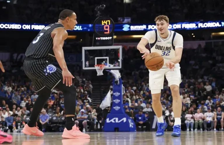 Dallas Mavericks forward Cooper Flagg (32) Orlando Magic guard Desmond Bane (3)