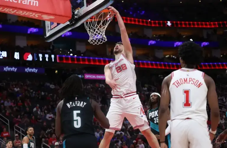 Houston Rockets center Alperen Sengun (28) dunks against Portland Trail Blazers guard Jrue Holiday (5) in the first half.