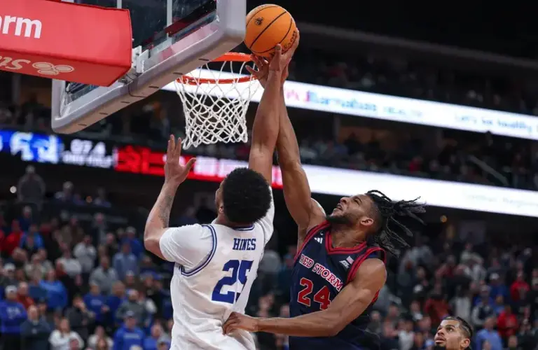 St. John's Red Storm forward Zuby Ejiofor (24) blocks a shot by Seton Hall Pirates center Najai Hines (25) during the second half.