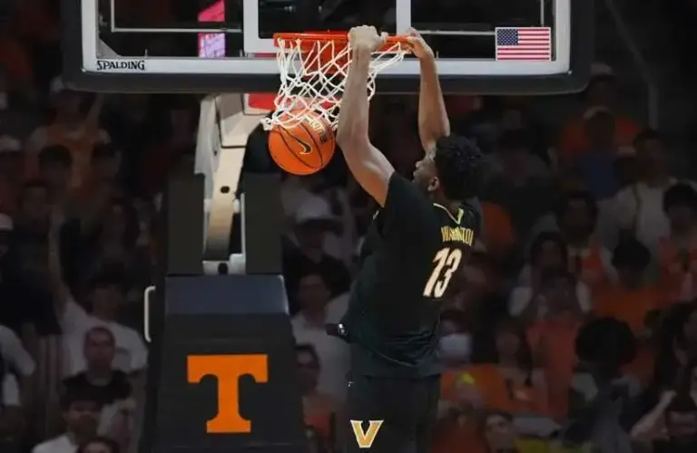 Vanderbilt's Jalen Washington (13) dunks the ball during a men’s college basketball game between the Tennessee Vols and Vanderbilt Commodores.