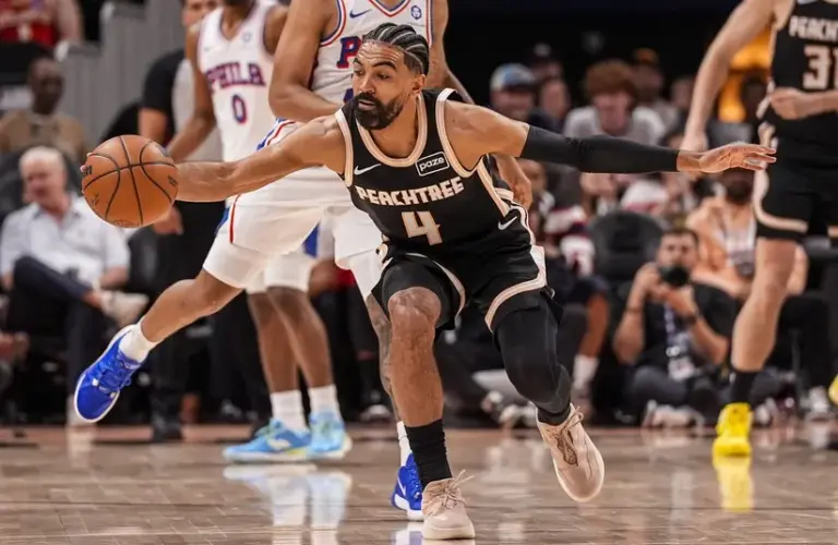 Atlanta Hawks guard Gabe Vincent (4) tracks down a loose ball against the Philadelphia 76ers
