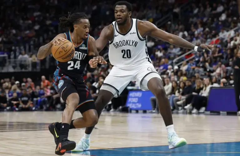 Detroit Pistons guard Daniss Jenkins (24) dribbles