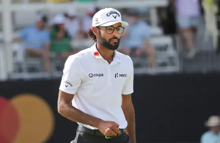Akshay Bhatia walks on the ninth green