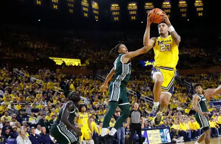 Michigan Wolverines forward Yaxel Lendeborg (23) shoots on Michigan State Spartans forward Jordan Scott (6) in the first half.