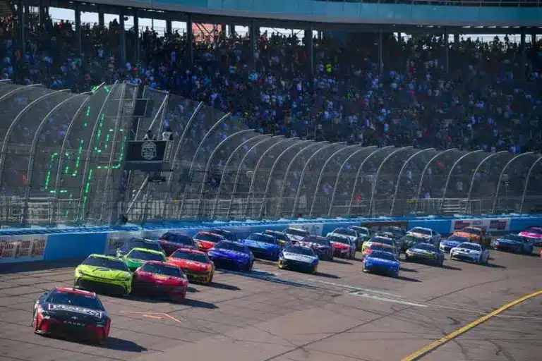 Mar 8, 2026; Avondale, Arizona, USA; Joe Gibbs Racing driver Christopher Bell (20) leads the field during the restart of the Straight Talk Wireless 500 at Phoenix Raceway.