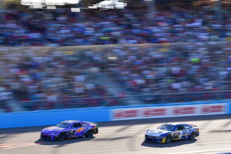 Mar 8, 2026; Avondale, Arizona, USA; Joe Gibbs Racing driver Ty Gibbs (54) leads Team Penske driver Ryan Blaney (12) during the Straight Talk Wireless 500 at Phoenix Raceway. Mandatory Credit: Gary A. Vasquez-Imagn Images