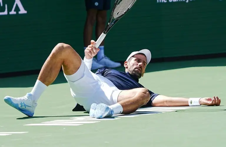 Djokovic falls on the court