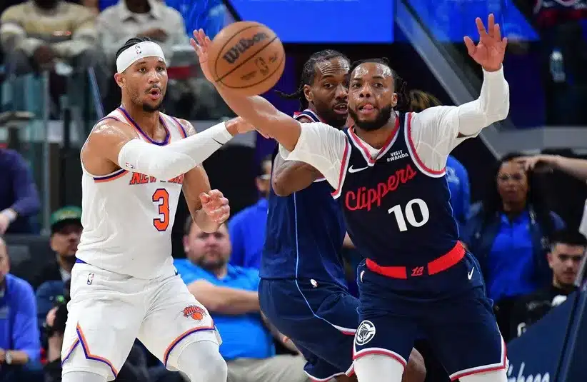Los Angeles Clippers guard Darius Garland (10) moves in for the ball as New York Knicks guard Josh Hart (3) passes during the second half