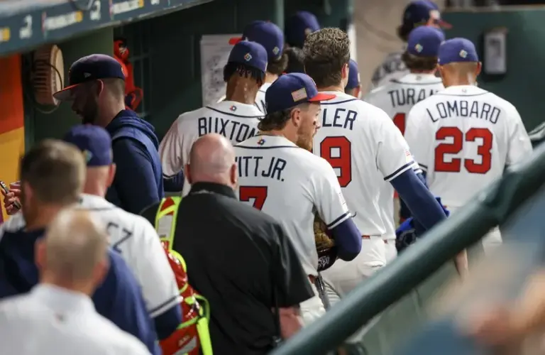 USA shortstop Bobby Witt Jr. (7) and teammates leave the dugout after being defeated by Italy