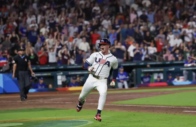 USA center fielder Pete Crow-Armstrong (4) reacts after hitting a home run