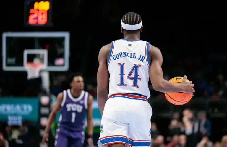 Kansas Jayhawks guard Melvin Council Jr. (14) brings the ball up court during the second half against the TCU Horned Frogs.