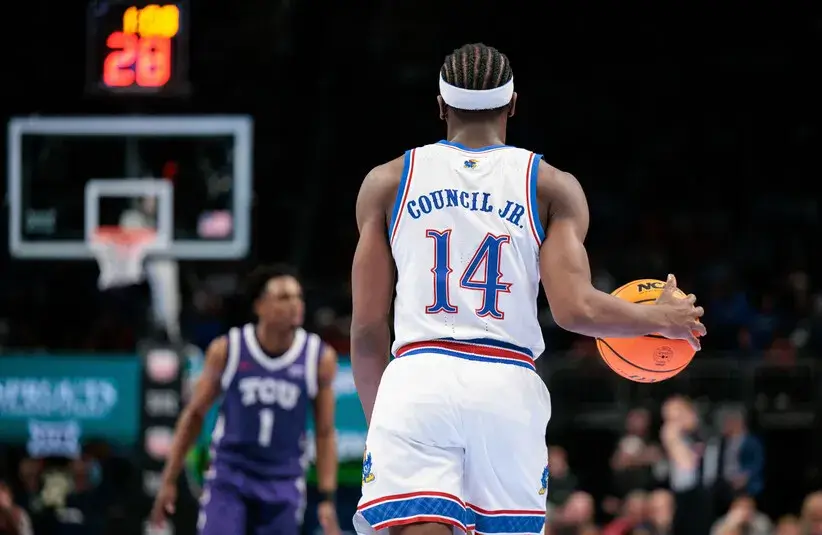 Kansas Jayhawks guard Melvin Council Jr. (14) brings the ball up court during the second half against the TCU Horned Frogs.