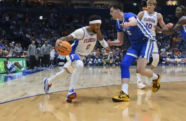Florida Gators guard Boogie Fland (0) drives baseline