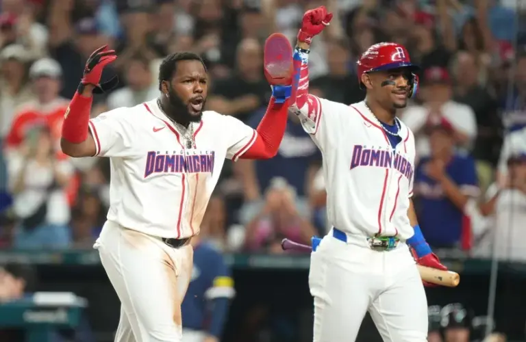 Dominican Republic first baseman Vladimir Guerrero Jr., left, and center fielder Julio Rodríguez celebrate