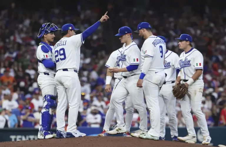 Italy manager Francisco Cervelli (29) calls to the bullpen