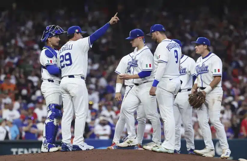 Italy manager Francisco Cervelli (29) calls to the bullpen