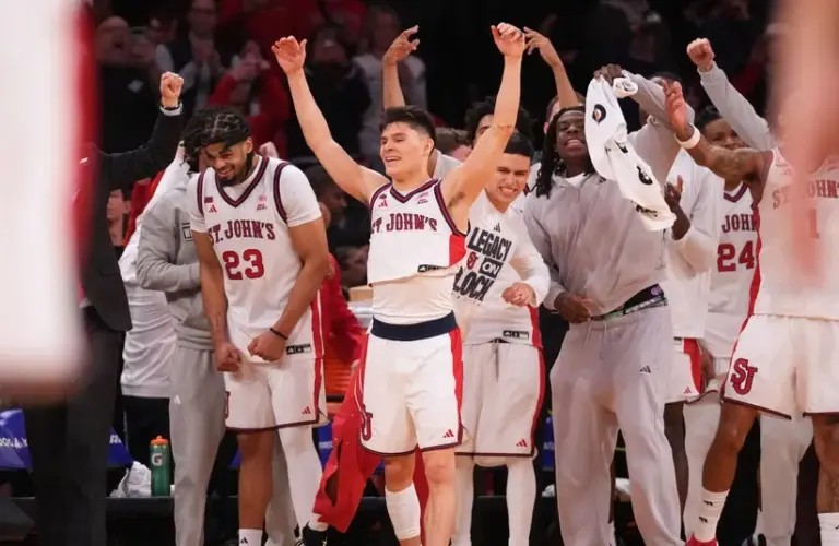 The St. John's Red Storm bench celebrates winning the men's Big East Conference Tournament Championship