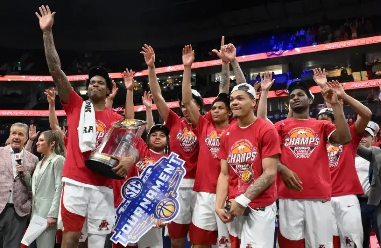 The Arkansas Razorbacks celebrate after the men's SEC Conference Tournament Championship against the Vanderbilt Commodores.