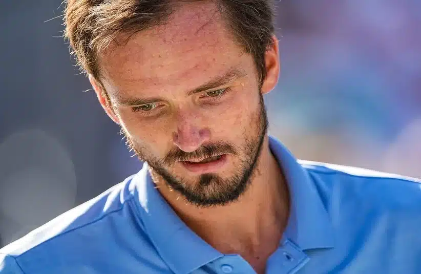 Medvedev looking at his racket