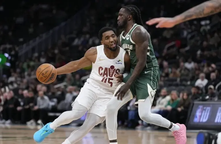 Cleveland Cavaliers guard Donovan Mitchell (45) drives