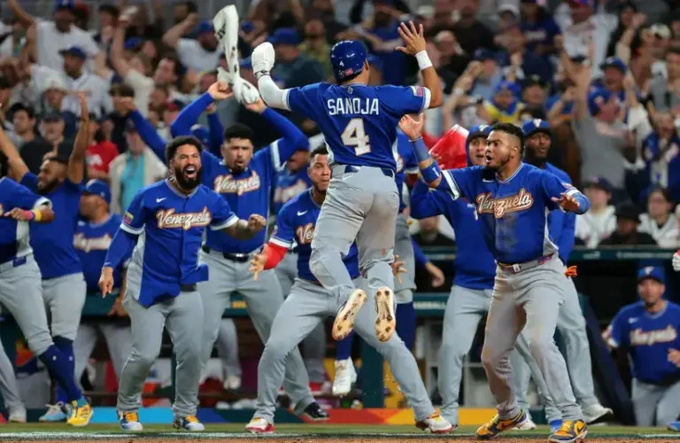 Venezuela outfielder Javier Sanoja (4) reacts after scoring a run against the United States in the ninth inning during the 2026 World Baseball Classic Championship game.