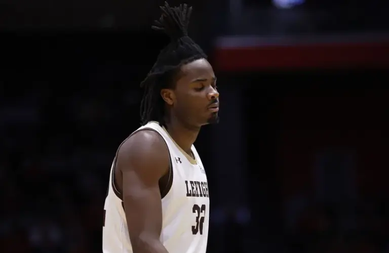 Lehigh Mountain Hawks center Henri Adiassa (32) reacts after being defeated