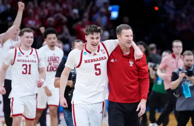 Nebraska coach Fred Hoiberg celebrates with Nebraska Cornhuskers forward Braden Frager (5)