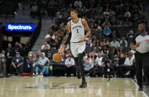 San Antonio Spurs forward Victor Wembanyama (1) dribbles up the court