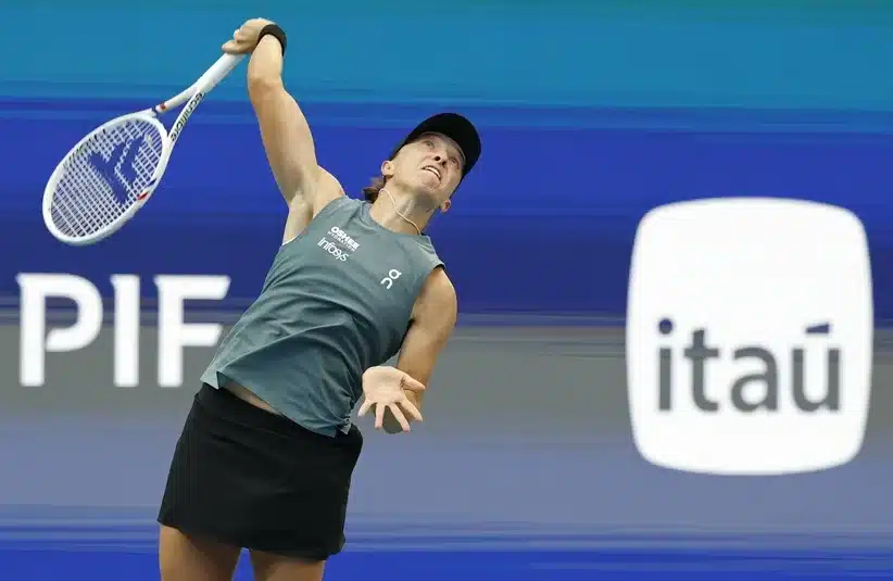 Swiatek serving during a match