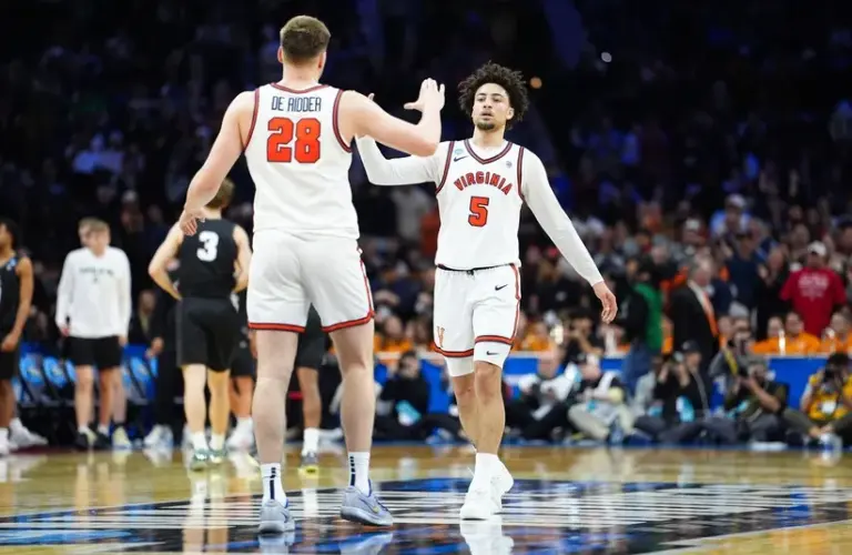 Virginia Cavaliers guard Sam Lewis (5) and Virginia Cavaliers forward Thijs de Ridder (28) celebrate after the game