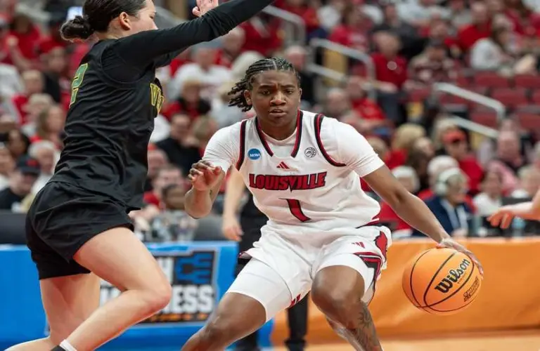 Louisville player on the court during game one of the NCAA Women's Tournament.