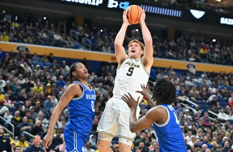 Michigan Wolverines forward Oscar Goodman (5) shoots the ball