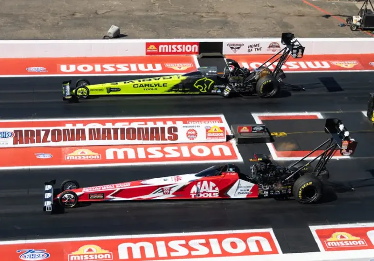 Mar 21, 2026; Chandler, AZ, USA; NHRA top fuel Driver Doug Kalitta (near) alongside Maddi Gordon during qualifying for the Arizona Nationals at Firebird Motorsports Park.