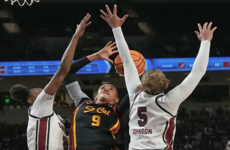 South Carolina forward Joyce Edwards (8) and South Carolina guard Tessa Johnson (5) defend the shot