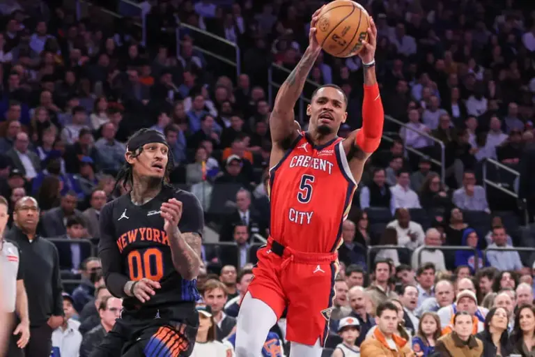 Mar 24, 2026; New York, New York, USA; New Orleans Pelicans guard Dejounte Murray (5) drives past New York Knicks guard Jordan Clarkson (00) in the third quarter at Madison Square Garden.